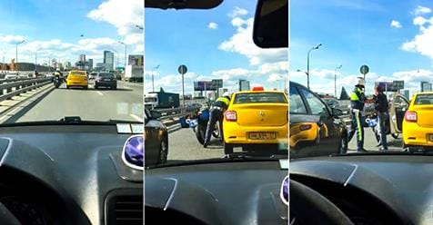 Videó: Pont a rendőrmotoros előtt kezdett izmozni a taxis